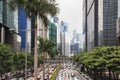 Detail of a street in central Hong Kong with many people walking on the street. On background local shops and restaurants Royalty Free Stock Photo