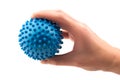 Detail studio shot right hand holding blue rubber massage ball isolated on white background. Contemporary rehabilitation Royalty Free Stock Photo