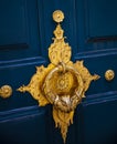 Stylish doorknocker on blue wooden door in Paris, France Royalty Free Stock Photo