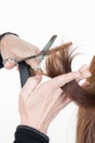 Detail of a stylist hairdresser drying womans hair in beauty salon Royalty Free Stock Photo