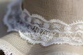 detail of a summer hats intricate lace brim