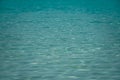 Detail of a sunlight reflecting in glittering sea. sparkler in water background. sea water with sun glare and ripple. Powerful and Royalty Free Stock Photo