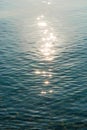 Detail of a sunlight reflecting in glittering sea. sparkler in water - background. sea water with sun glare and ripple Royalty Free Stock Photo