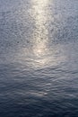 Detail of a sunlight reflecting in glittering sea. sparkler in water - background. sea water with sun glare and ripple. Powerful Royalty Free Stock Photo