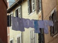 Supended laundry in a street of Trastevere to Rome in Italy. Royalty Free Stock Photo