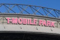 Detail of T Mobile Park baseball stadium sign in pink with roof structure