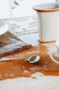 table with a puddle of coffee spilled accidentally Royalty Free Stock Photo