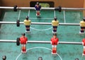 Detail of table football soccer game with red and yellow players Royalty Free Stock Photo