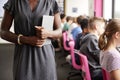 Detail Of Teacher With Digital Tablet Talking To Line Of High School Students Sitting By Screens In Computer Class Royalty Free Stock Photo