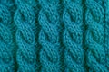 Detail of teal cable knitting stitch