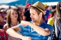 Detail of teenage boy at summer music festival dancing