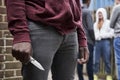 Close Up Of Teenage Boy In Urban Gang Holding Knife Royalty Free Stock Photo