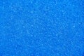 Detail of the texture of a blue artificial grass paddle tennis court