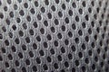 Texture of a grey fabric with holes