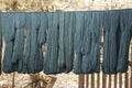 Detail of texture of traditional Indigo blue natural dyed thread desiccate drying indoor Royalty Free Stock Photo