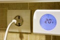 Detail of the thermostat of an electric heater at 20 degrees Celsius Royalty Free Stock Photo