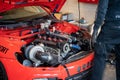 Detail of a third generation red Volkswagen Scirocco in the workshop Royalty Free Stock Photo
