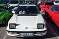 Detail of the third-generation white Honda Prelude old Japanese sports car, with folding headlights.