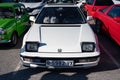 Detail of the third-generation white Honda Prelude old Japanese sports car, with folding headlights.