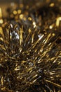 Detail of a tinsel garland in gold and silver material. Christmas decoration