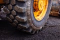 Detail on tire track pattern on a yellow heavy duty digger excavator Royalty Free Stock Photo