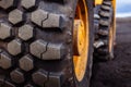 Detail on tire track pattern on a yellow heavy duty digger excavator Royalty Free Stock Photo