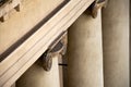 Detail from the top of an ionic column showing the presence of pigeon deterring spikes Royalty Free Stock Photo