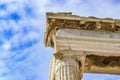 Detail of the top of a repaired column on the Parthenon on the Athens Acropolis against a beautiful blue sky with fluffy clouds Royalty Free Stock Photo