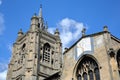 Detail of the tower and spire of the Church of St Peter Mancroft with the cross keys sundial in the foreground, Norwich, Norfolk, Royalty Free Stock Photo