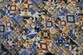 Detail of a traditional colorful tiled floor with repeating floral motifs forming beautiful ornamental patterns