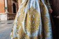 Detail of the traditional fallera dress, with rich golden thread embroidery on a silk skirt Royalty Free Stock Photo