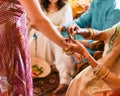 Detail of a traditional Indian religious wedding - bride wearing beautiful garments, jewelry and henna tattoo