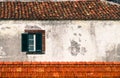 Detail from traditional old Portuguese facade with green and white wooden window