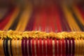 Detail of traditional vintage weaving hand loom with wool close up. Weaving background. Craftsmanship background