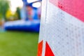 Detail of a traffic cone with reflective safety material