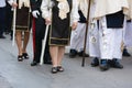 detail of the trditional dresses of christian confraternity members