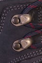 Detail of trekking shoes hook and loop.