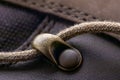 Detail of trekking shoes hook and loop for strap. Close-up photo of brown shoelaces on boot, shoe brass hooks Royalty Free Stock Photo