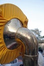 Bell of a Queen Brass Sousaphone in the street.