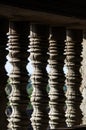 Detail of the turned stone bars of a window at the Angkor Wat in Royalty Free Stock Photo