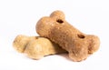 Detail of two dog treats, goody bones isolated on white background.