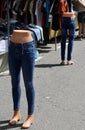 Detail of two mannequins wearing blue jeans.