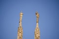 Detail two statues in front of Milan Cathedral Royalty Free Stock Photo