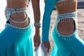 Detail of two young and beautiful belly dancers dancing in a square. They are dressed in light blue with white veils in their Royalty Free Stock Photo