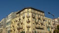 Detail of typical portuguese apartment building in yellow pastel color