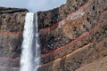 Detail of the upper part of waterfall Hengifoss with colored cliff in eastern Iceland Royalty Free Stock Photo