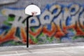 Urban basketball hoop inner city innercity wall and asphalt in o