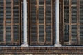 Detail of venetian shutters and columns