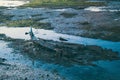 detail of the Venice lagoon, remains of a gondola that resurface at low tide.