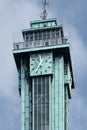 Detail vertical shot of big clock on the top of the tower of Ostrava New City Hall. Steel construction with copper Royalty Free Stock Photo